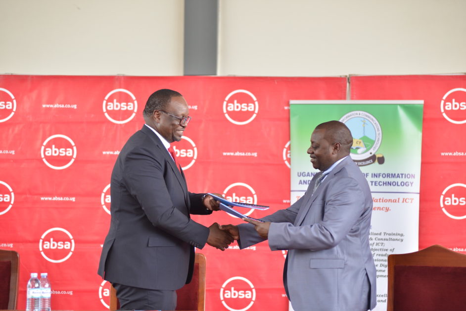 Mumba Kalifungwa, Managing Director, Absa Bank Uganda (left) and Dr Fredrick Kitoogo, the Principle the Uganda Institute of Information and Communication Technology exchange partnership documents. Absa is supporting the enhanced delivery of ICT training to students. 500 instructors and youth are receiving Amazon Web Services (AWS) Cloud Practitioner Certification training.