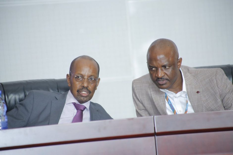Mr Muhakanizi (left) with his replacement at Ministry of Finance, Mr. Ramathan Ggoobi