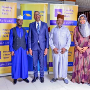 From Left to right - Sheikh Naswif Kizito, HFB MD Michael Mugabi, Hajji Sonko Najib long-term customer for the Bank and Executive Director Peace Ayebazibwe pose for a picture during the dinner held at Hotel Africana for its Muslim customers and staff