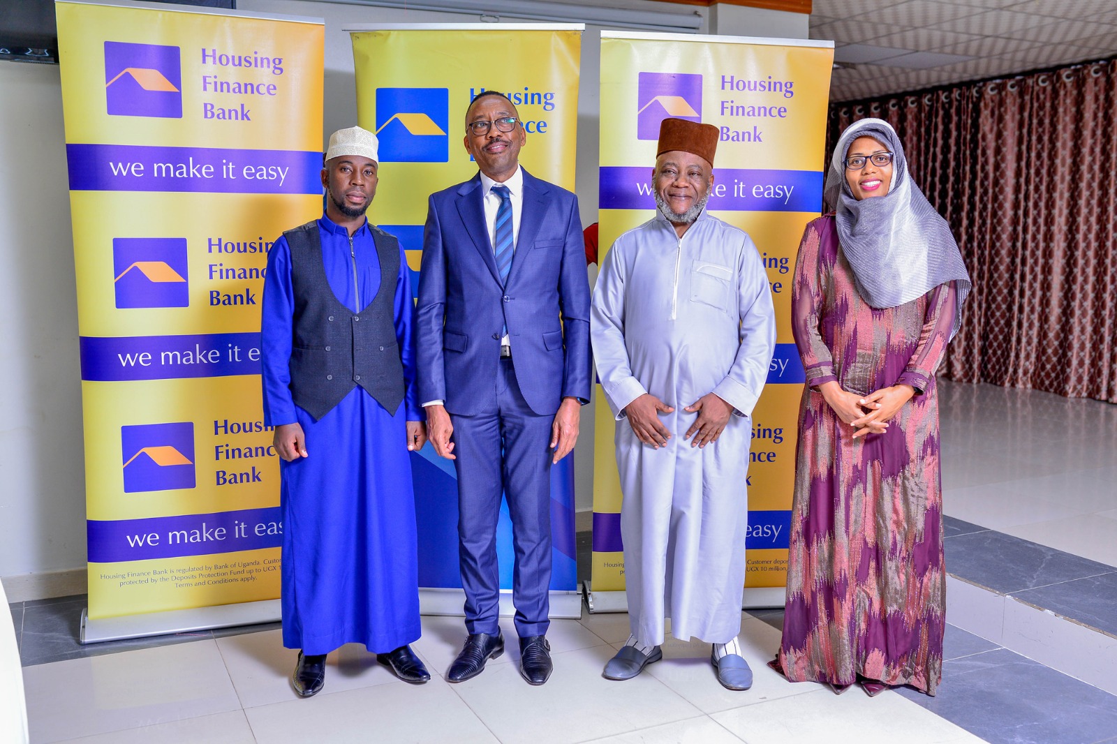 From Left to right - Sheikh Naswif Kizito, HFB MD Michael Mugabi, Hajji Sonko Najib long-term customer for the Bank and Executive Director Peace Ayebazibwe pose for a picture during the dinner held at Hotel Africana for its Muslim customers and staff