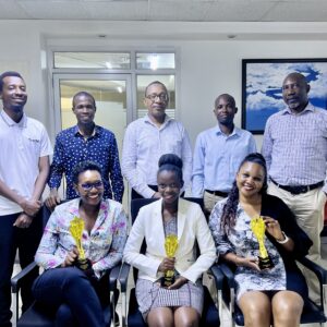 Part of the Media Age team pose with the awards.