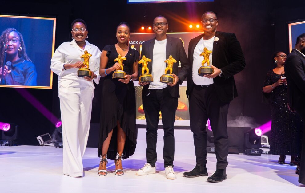 Emmy Hashakimana and Uganda Breweries marketing team holding awards for Tusker Lite, Johnnie Walker, Uganda Waragi, and Smirnoff campaigns at 2023 Silverback and UMEA Awards, Emmy Hashakimana, Coca-Cola Beverages Uganda, Coca-Cola Beverages Africa, Melkamu Abebe, CCBU leadership changes, Coca-Cola Leadership Changes in Uganda, Coca-Cola Uganda leadership, Ugandan business leaders, CCBU General Manager Uganda, Beverage industry Uganda, Emmy Hashakimana appointed Coca-Cola Uganda GM, Coca-Cola Beverages Africa leadership transitions, Ugandan executives in multinational companies, Leadership succession at Coca-Cola Uganda, CEO East Africa Magazine, East Africa Business News, Business News, Uganda Business News,