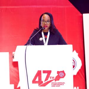 Grace Muliisa speaking at the 47th OESAI Annual Conference at Speke Resort Munyonyo, sharing her vision for the future of customer experience in Africa’s insurance industry.