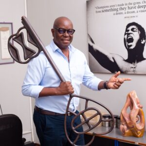 David Galukande — advertising pioneer, co-founder of QG Saatchi & Saatchi — photographed in various professional and creative settings, reflecting on his career journey, industry awards, leadership in brand storytelling, embrace of MarTech innovation, and commitment to cultural authenticity, adaptability, and client-focused creativity in Uganda’s advertising industry.