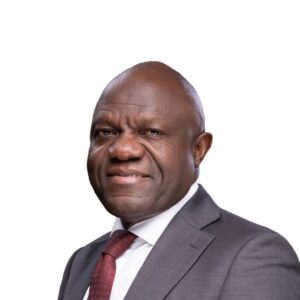 Baker Magunda, Partner at MANATI Africa International, smiling while speaking at a corporate event.