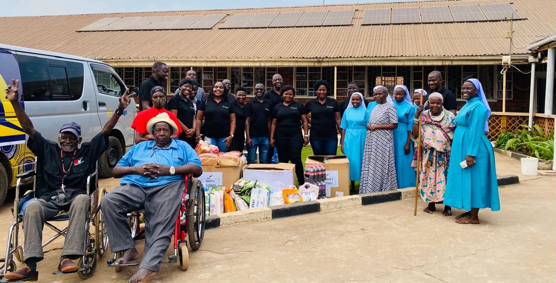 Letshego Uganda 20th Anniversary – Giles Aijukwe with partners, customers, and community members showcasing two decades of financial inclusion, affordable credit, and digital innovation for underserved markets.