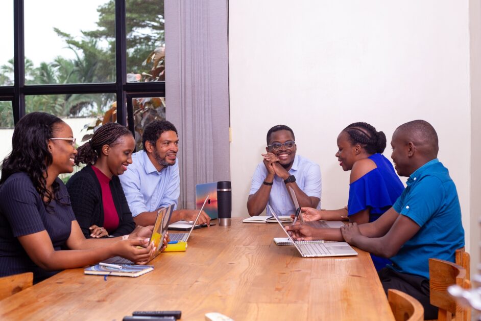 Peter Magona, Managing Director of TBWA\Uganda, in various settings including team meetings, award celebrations, and office portraits, reflecting his leadership in the advertising industry.