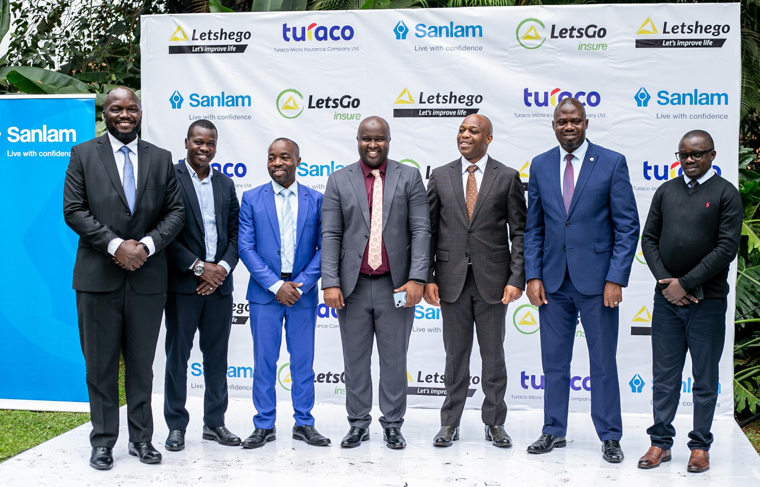 Letshego Uganda 20th Anniversary – Giles Aijukwe with partners, customers, and community members showcasing two decades of financial inclusion, affordable credit, and digital innovation for underserved markets.