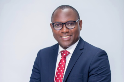 Peter Ssenyange, CFO of PostBank Uganda (now Pearl Bank Uganda Ltd) and Uganda’s CFO of the Year 2025, poses confidently in a navy suit and red tie. His leadership philosophy—anchored in strategy, people empowerment, innovation, and value creation—reflects his belief that a great CFO is both a trusted advisor to the CEO and a custodian of sustainable growth.