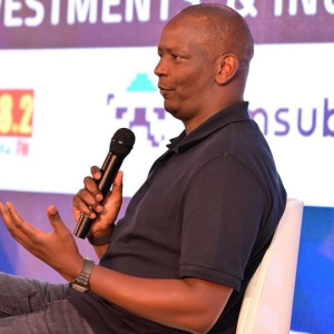 M-PESA Africa Managing Director Sitoyo Lopokoiyit speaks at the 2025 Fintechs Annual Gathering in Kampala, urging Africa to shape its own digital destiny through innovation, youth empowerment, and regional collaboration.