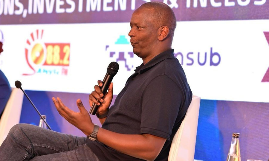 M-PESA Africa Managing Director Sitoyo Lopokoiyit speaks at the 2025 Fintechs Annual Gathering in Kampala, urging Africa to shape its own digital destiny through innovation, youth empowerment, and regional collaboration.