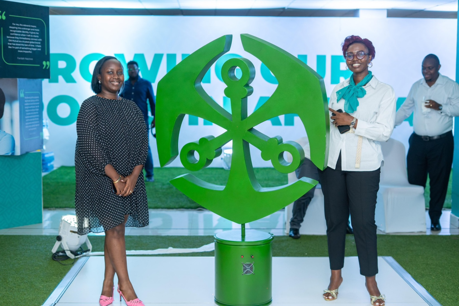 Celebrating a new look: Old Mutual staff unveil the anchor icon from the Old Mutual logo in Kampala, Oct. 8, 2025 — a moment that symbolised the company’s evolution from UAP Old Mutual to a unified Pan-African identity, reaffirming its strength, stability, and renewed ambition in Uganda’s transforming financial landscape.