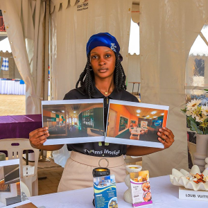 An entrepreneur showcases some of her products during the dfcu Rising Woman Expo on November 14. The expo is empowering women-led enterprises with training, mentorship, and market access, helping entrepreneurs strengthen their businesses, gain visibility, and build the skills needed to drive sustainable growth across Uganda.
