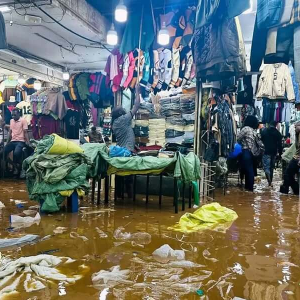 Once a vital drainage artery of Kampala, the Nakivubo Channel has become a tragic symbol of urban neglect. Buildings encroach, wetlands vanish, and rainstorms now trigger deadly floods. The city’s clogged lifeline floods again, reminding us that infrastructure failure and environmental collapse walk hand-in-hand.