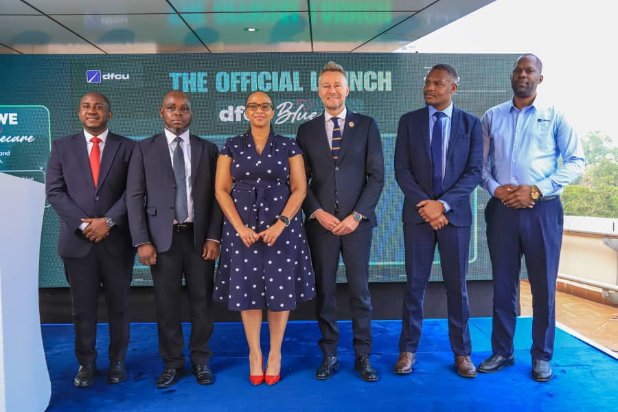Maryann Wanjiku Michuki, Chief Business Solutions Marketing Officer at dfcu Bank (3rd L) and Jubilee Health Insurance Executives pose for a group photo during the launch of the dfcu BlueCare Insura
