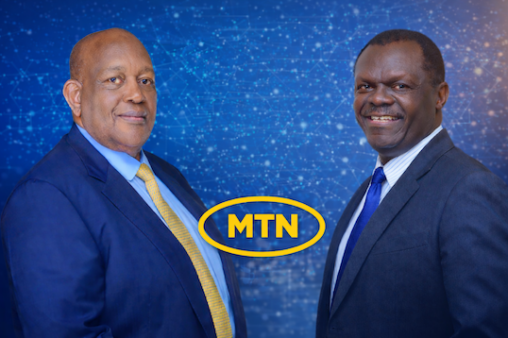 Charles Mbire (left) and NSSF Managing Director Patrick Ayota (right) pictured with the MTN Uganda logo as MTN shares rally and NSSF’s stake surpasses UGX 1 trillion.