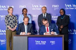 FMO Co-Chief Investment Officer Huib-Jan de Ruijter (left) and I&M Bank Uganda CEO Robin Bairstow sign the Memorandum of Understanding following the announcement of a USD 20 million financing partnership. Standing behind them (left–right) are Natalie den Breugom, Deputy Director for Sustainable Economic Development at the Dutch Ministry of Foreign Affairs; Faith Kathambi, Investment Officer – Financial Institutions at FMO; René Idzenga, Head of State-Owned Enterprises at the Dutch Ministry of Finance; and Nadia Mindra, Head of Treasury at I&M Bank Uganda.