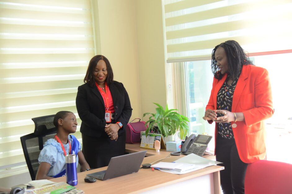 Absa Bank Uganda Managing Director David Wandera (second left) exchanges documents with Rachel Mwagale of Junior Achievement Uganda during the signing of a three-year partnership to extend financial literacy to students nationwide—an initiative that underscores the bank’s commitment to youth empowerment and inclusive growth, translating its 2025 performance into long-term investment in skills, opportunity, and economic participation.