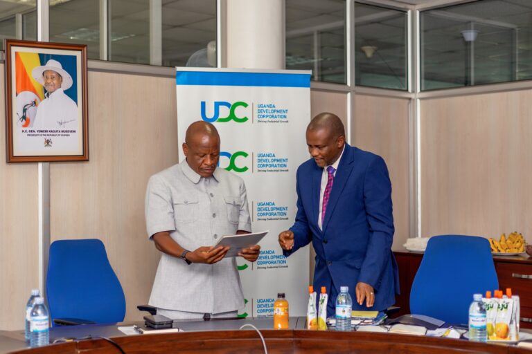 State Trade Minister Wilson Mbasu Mbadi and UDC Executive Director Patrick Birungi engage during a visit to present key UDC documents, including the UDC Strategic Plan, the UDC Act 2016, and the corporation’s profile, as part of efforts to align on its mandate and future investments. However, growing concern in Parliament has emerged over the corporation’s dominant share of trade sector funding.